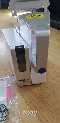 AQUATRU COUNTERTOP WATER SYSTEM with filters and 2 new filters